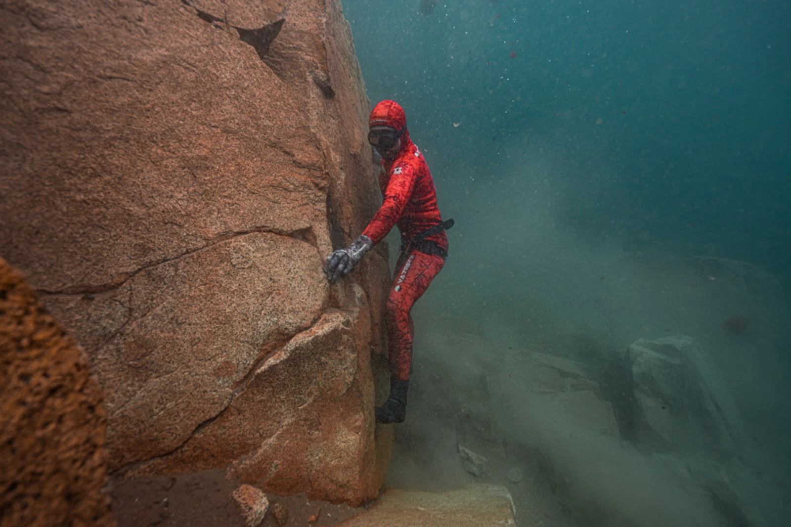 JD scaling underwater rock faces that are similar to Alaska’s rugged coastline. Photo Credit: Adam Moore